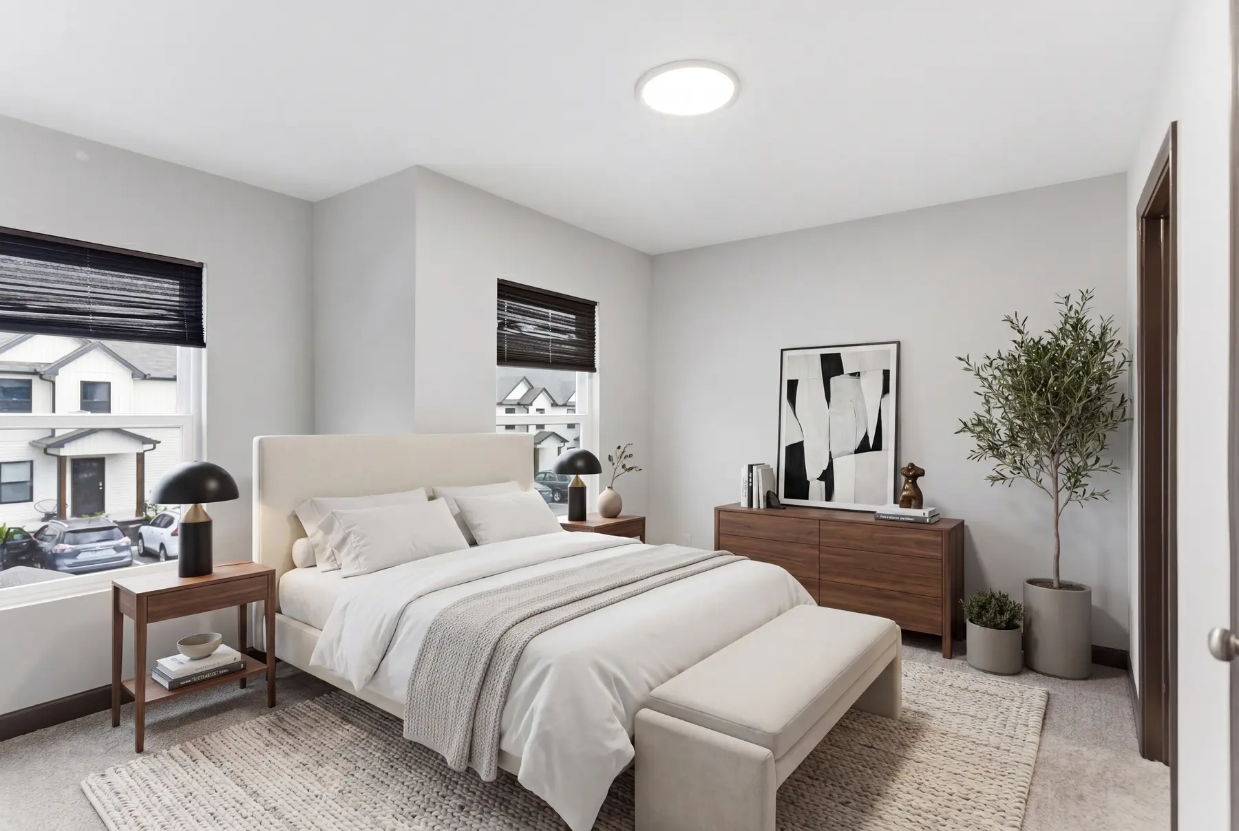 Staged bedroom with a light upholstered bed