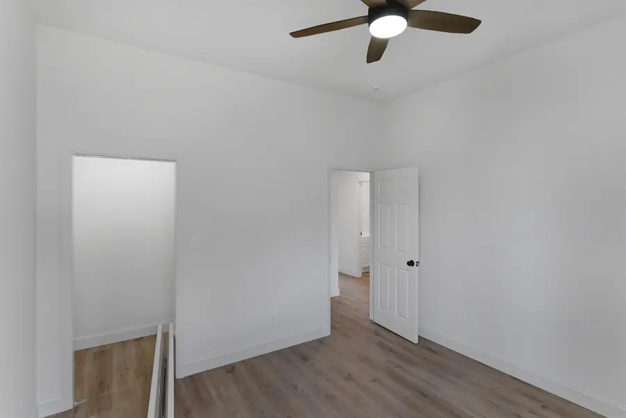 Room with a ceiling fan and the stair opening