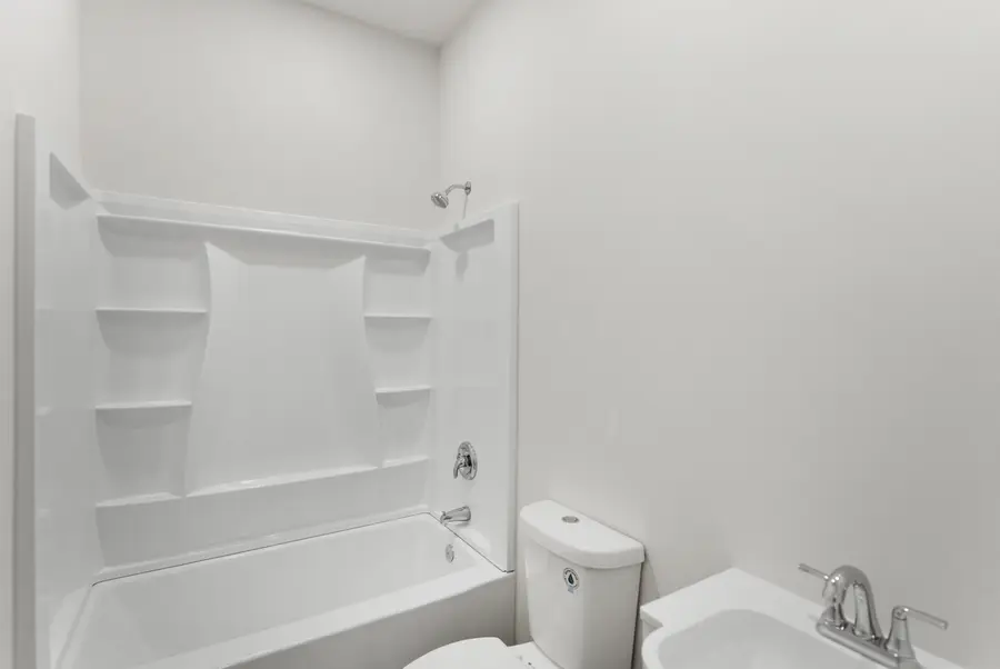 Bathroom with a white tub shower