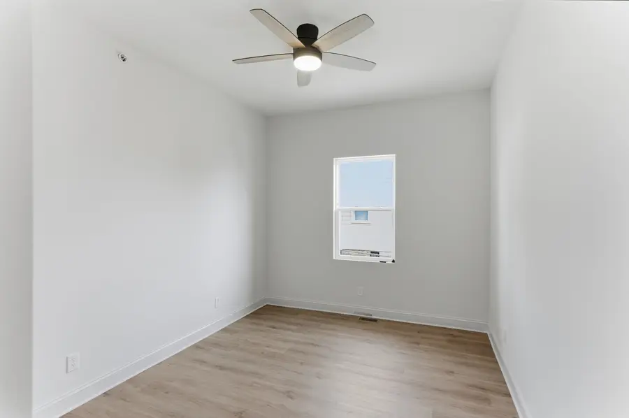 Bedroom with a ceiling fan and one window