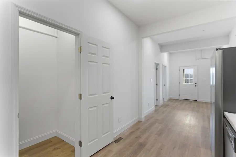 Hall with white doors leading to the living area