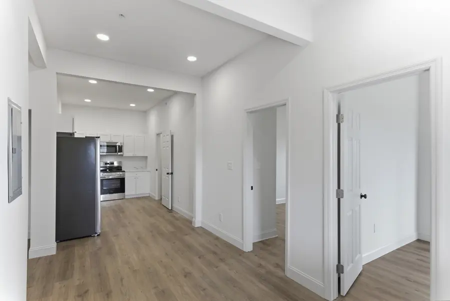 Open living area with the kitchen at the far end
