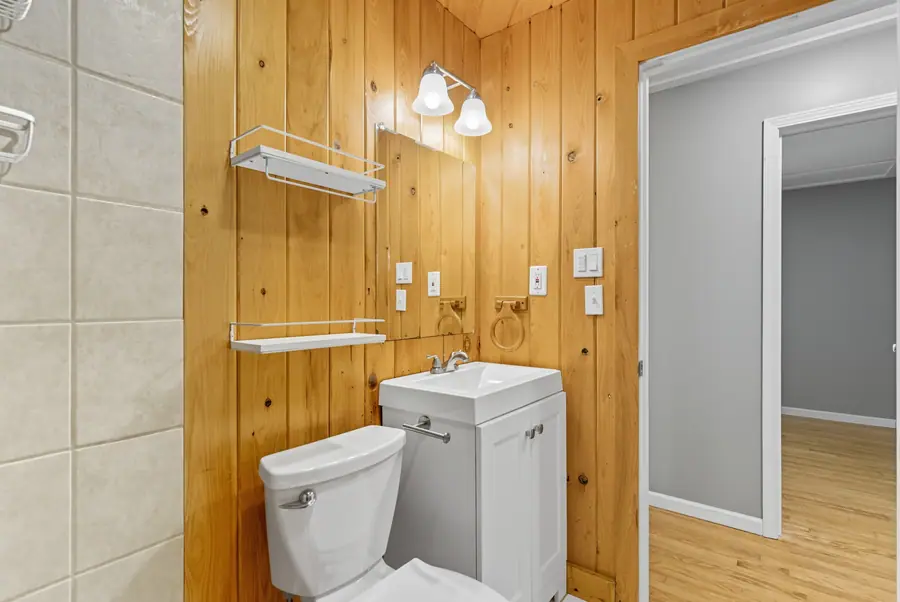 Bathroom with cedar panelled walls