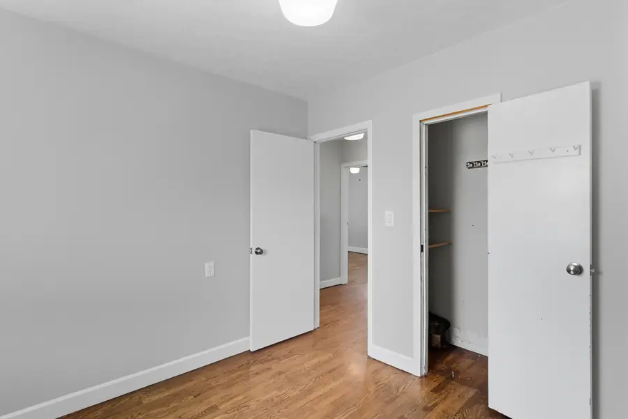 Bedroom with a closet and hardwood floors