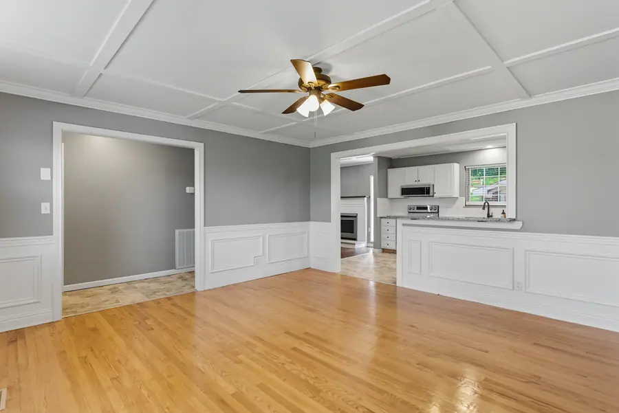 Dining room with wainscot panelling and hardwood floors