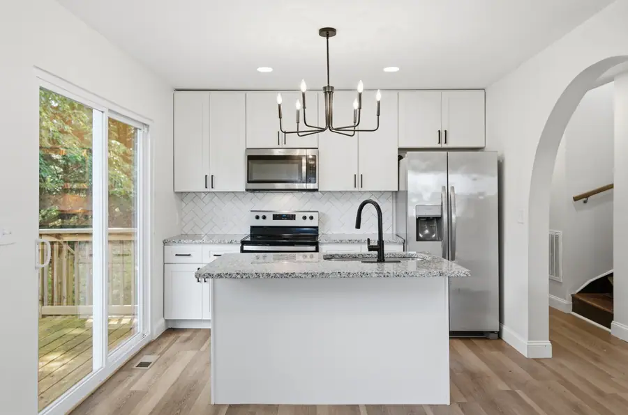 Renovated kitchen with a centre island and pendant lighting