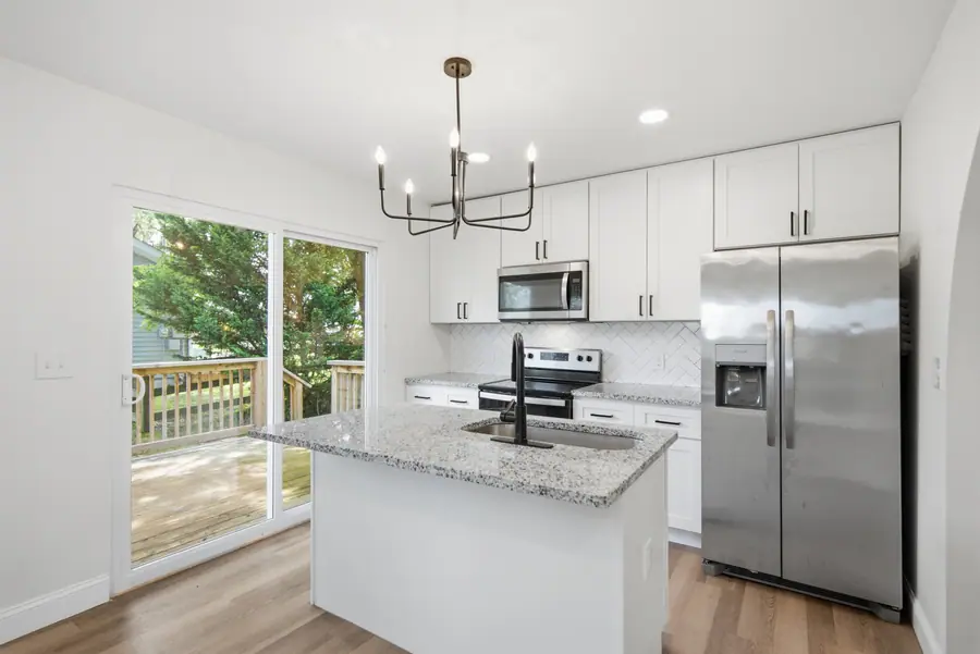 Kitchen island with doors out to the deck