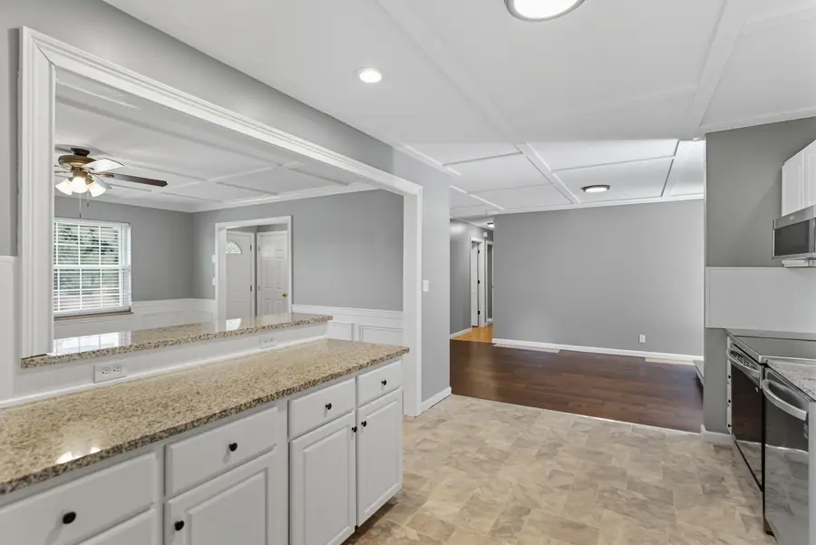 Kitchen with a granite pass through to the living space
