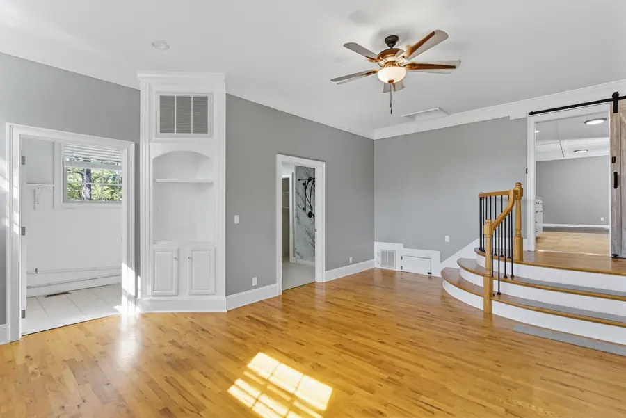 Refinished hardwood floors in an open living space
